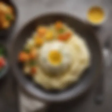 A plate of cauliflower mashed potatoes served alongside a colorful meal