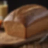Loaf of whole grain wheat bread on a wooden table