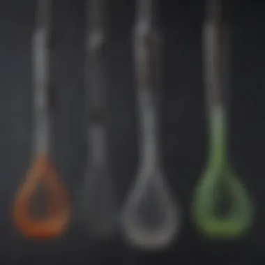 An assortment of whisk attachments with different sizes and shapes.