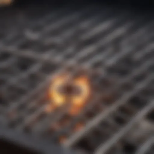 Close-up of a gas grill burner showing wear and corrosion