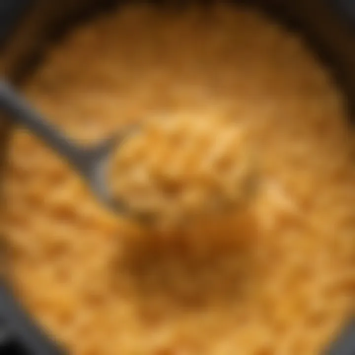 Close-up view of melted cheese and macaroni texture in the crockpot