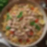 A vibrant bowl of cold tuna salad with pasta adorned with fresh herbs