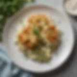 A beautifully arranged plate of Hidden Valley Ranch Cauliflower Casserole, garnished with fresh herbs.