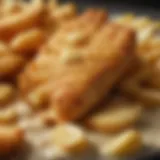 Close-up of golden-brown fish and chips with batter