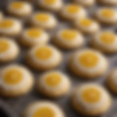 A close-up of freshly baked Meyer lemon cookies adorned with a light glaze.