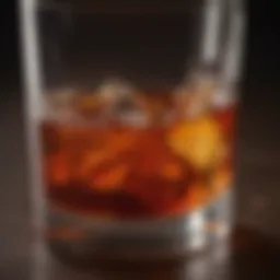 A close-up of a whiskey glass filled with Red Wing Whiskey, showcasing its rich amber color.