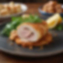 A beautifully plated Chicken Cordon Bleu garnished with herbs.