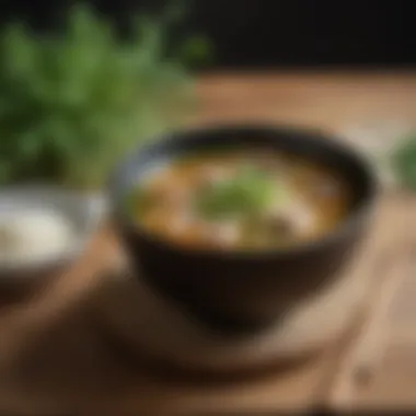 Miso Soup with Fresh Herbs in a Serene Setting A serene setting with miso soup and fresh herbs on a wooden table
