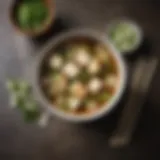 A vibrant bowl of miso soup garnished with scallions and tofu