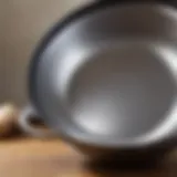 A close-up of a premium stainless steel frying pan reflecting light