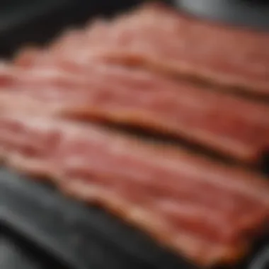 Raw bacon ready for slow cooking in the oven