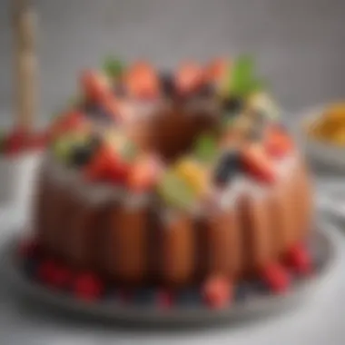 Finished Bundt cake adorned with fresh fruits and icing