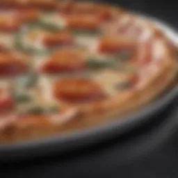 Close-up of a stainless pizza pan showcasing its shiny surface and durability.