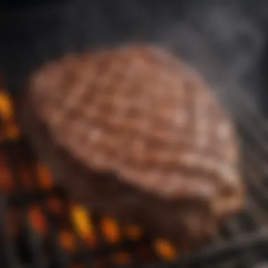 The grill with a beautifully seared steak resting on the grates.