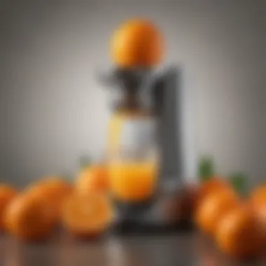 Glass orange juicer alongside vibrant oranges