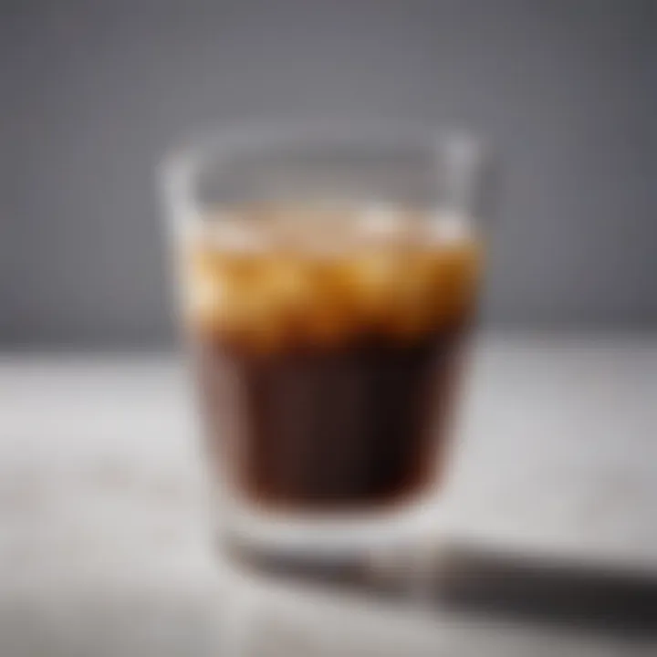 Glass cup highlighting the rich color of brewed coffee